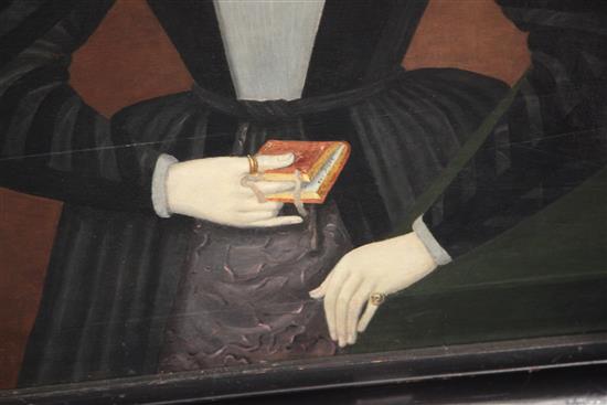 Mid 17th century English School Half length portrait of a lady wearing a ruff collar and memorial ring, and holding a missal 34 x 26in.
